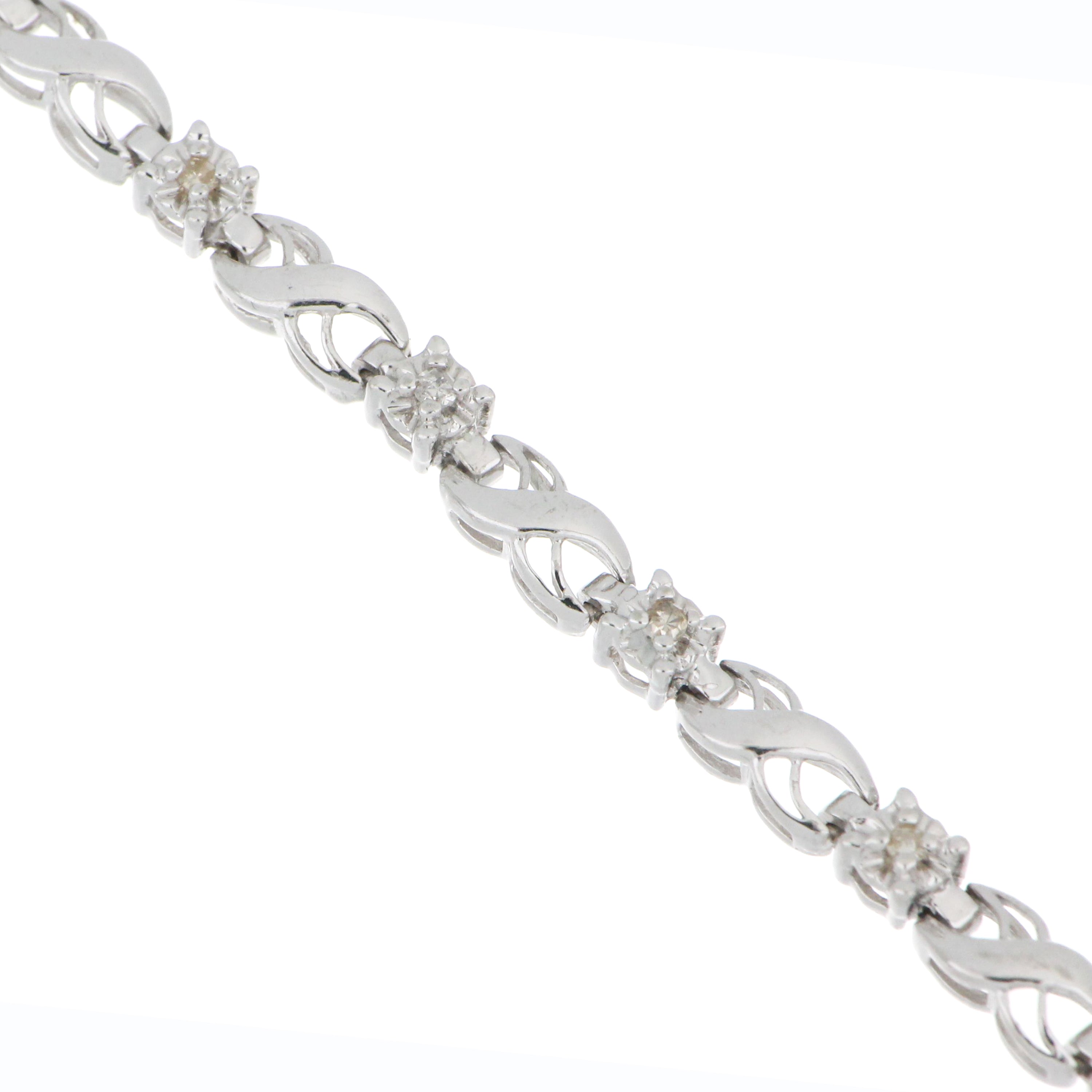 Pre-owned white gold bracelet with 0.40ct champagne diamonds in wave-link design.